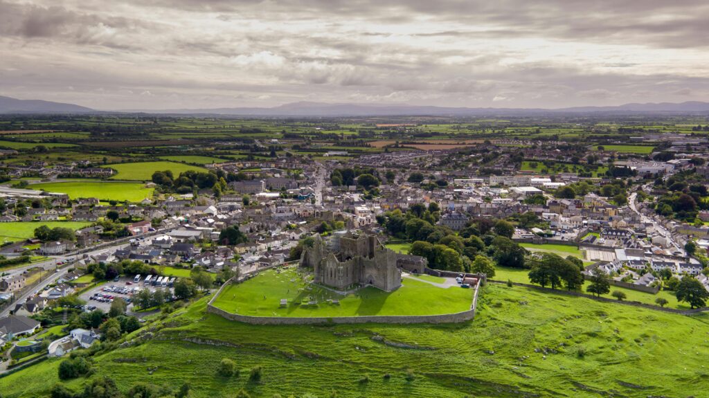 pexels-photo-2881405-2881405 Aerial view of a historic castle surrounded by lush green countryside and a picturesque town.